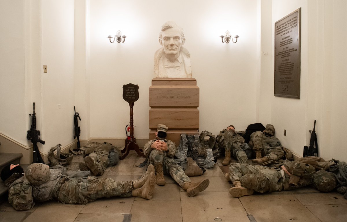 ajplus's tweet photo. Hundreds of National Guard members are on 24-hour watch in the U.S. Capitol, many sleeping in the hallways.

A new 7-foot fence and other security measures are in place after the pro-Trump riots last week. About 20,000 Guard members are ordered to D.C. ahead of the inauguration. https://t.co/uwKy61bnXY
