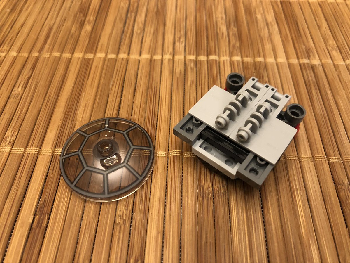 A few sloped blocks finish the chassis, then we build the front canopy and cockpit glass, which hinges forward.  #LEGO  