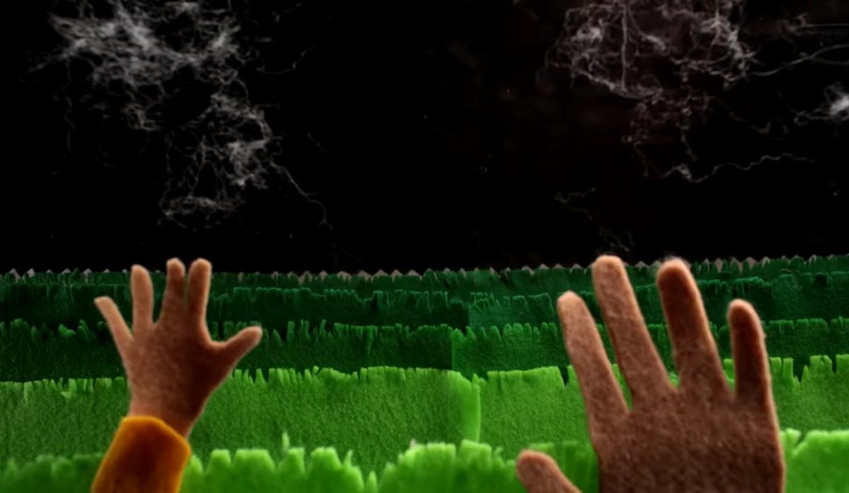 they kinda morph after that and that literally represents the dynamic that happens between them, they get ideas and transform them to art, later we see the guys running and finding a fence that won't let them go, then the fence flips, turning to these kinda stairs and they can +