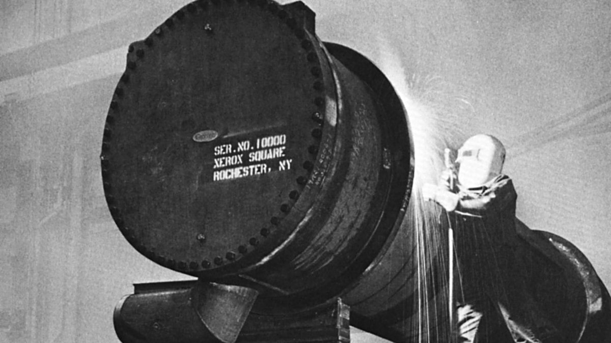 A hot job for a cool piece of equipment! In 1967, a worker puts the finishing touches on Carrier's 10,000th centrifugal chiller.