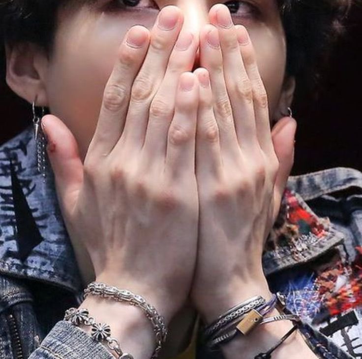 Him covering his face with his long fingers