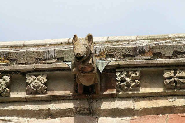 a pig playing the bagpipes and another wearing a tiara, both Melrose Abbey Scotland
