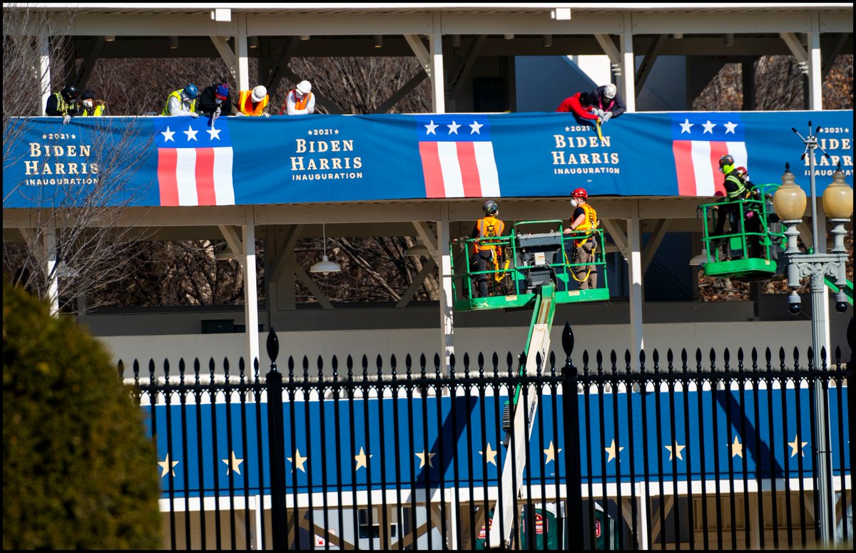 dougmillsnyt's tweet image. Inaugural workers place Biden/Harris bunting across the street from the White House ahead of next week's Inauguration.