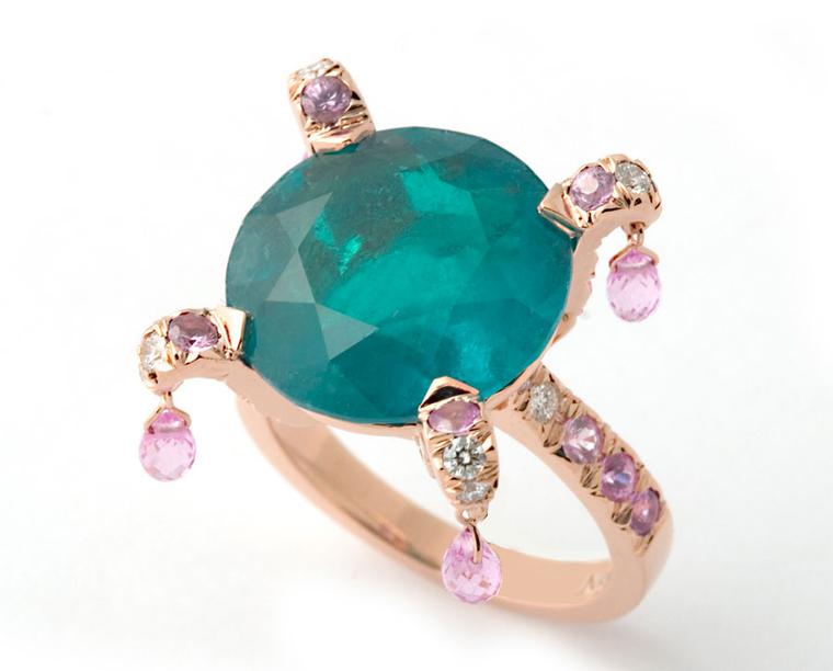 A brilliant cut emerald (which I've complained about just today!) but protected by the setting, with little pink sapphire briolettes. Reminds me of a court jester's hat. (Nardi)