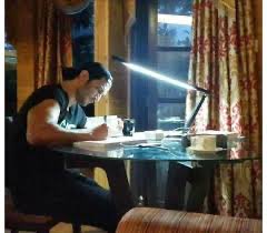 sushant is grading papers at his desk   #CordialLikeSSR