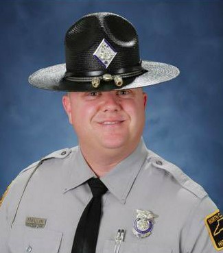 North Carolina state trooper Mark Melvin is placed on leave after social media posts showed him attending Jan 6th riot.