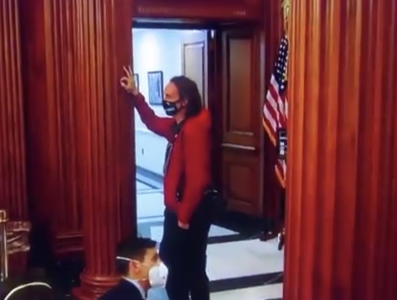 TricDrake's tweet photo. @cherylrosenbrg @RepKClark @CoriBush I was stunned. And  it is so creepy to watch how slowly and deliberately he moves his fingers into that position, if you watched it. It was moments before @SpeakerPelosi walked in to sign the article. https://t.co/jxwMp8AHnr