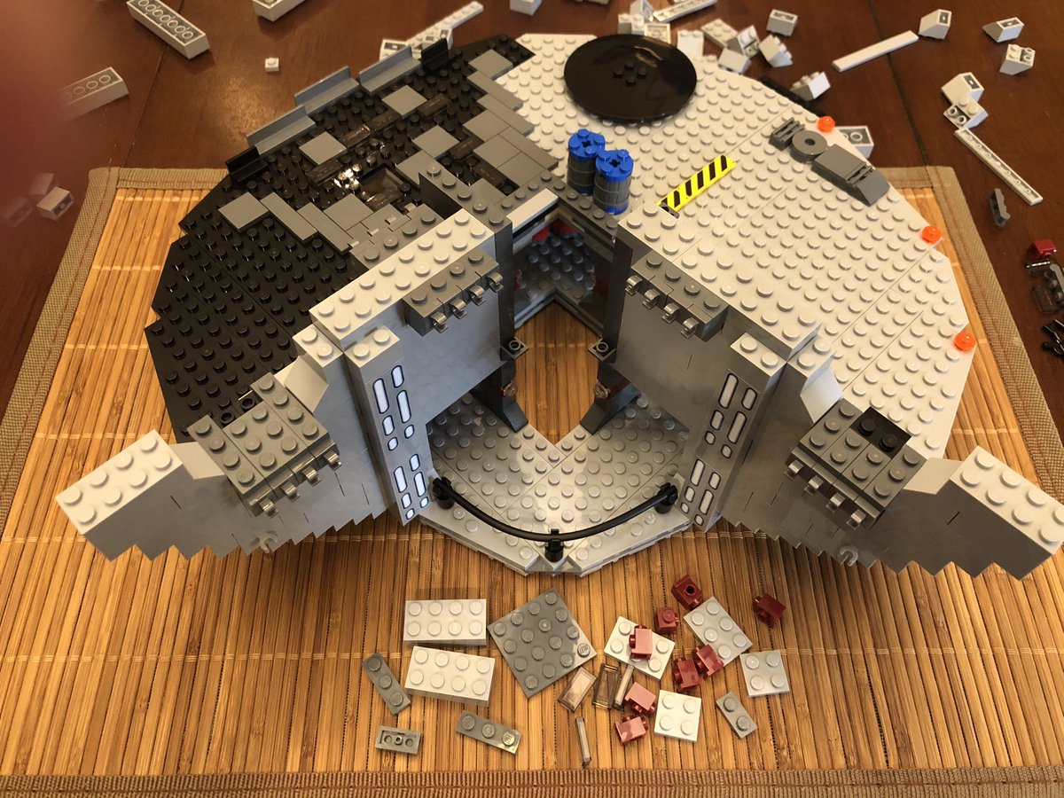 In each photo are the blocks for the next step, since I can’t really zoom in and show much detail. Here we see some red blocks halfway up each doorway.  #LEGO  