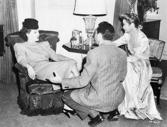 A photo from the set with director Vincent Sherman talking with Bette Davis and Miriam Hopkins.  #OldAcquaintance  #TCMParty