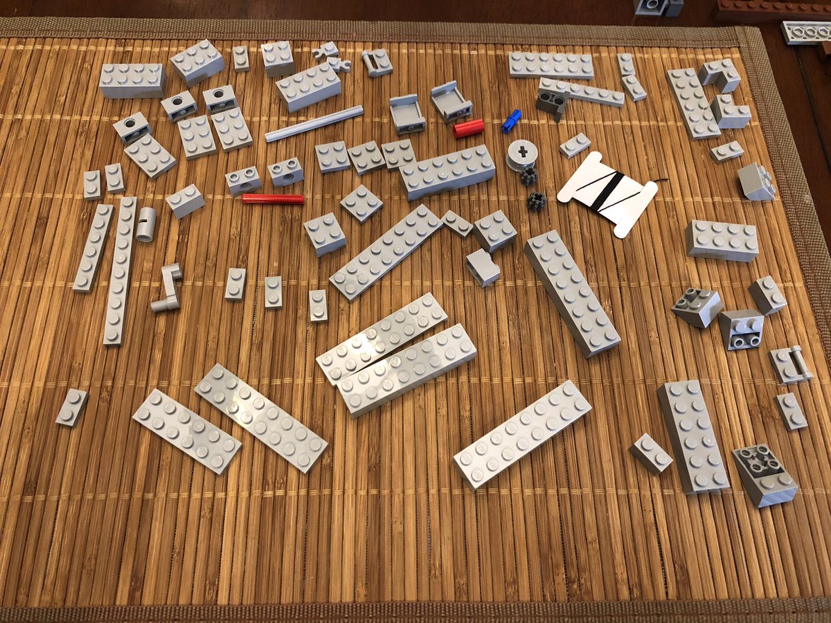 A really long shaft goes in this device here, then all these pieces are going to make the wall next to it. The first interesting part is this pulley with a crankshaft.  #LEGO  