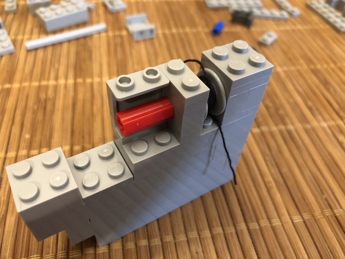There’s a little gear exchange here, and a handle goes on the outside. It’s a little difficult to turn now, with the two gears it requires high torque and there nothing anchoring it yet. A few more layers go on top.  #LEGO  