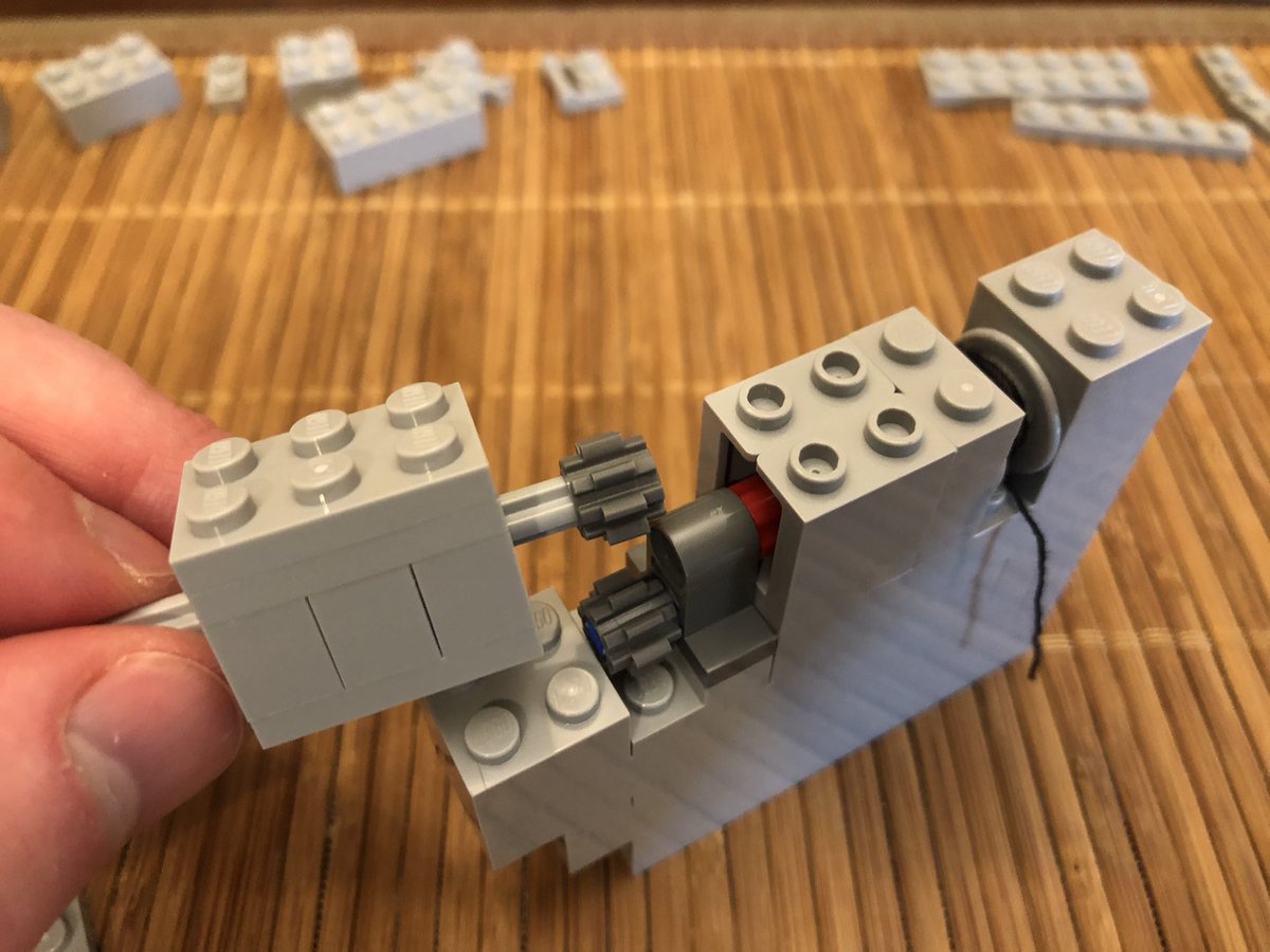 There’s a little gear exchange here, and a handle goes on the outside. It’s a little difficult to turn now, with the two gears it requires high torque and there nothing anchoring it yet. A few more layers go on top.  #LEGO  