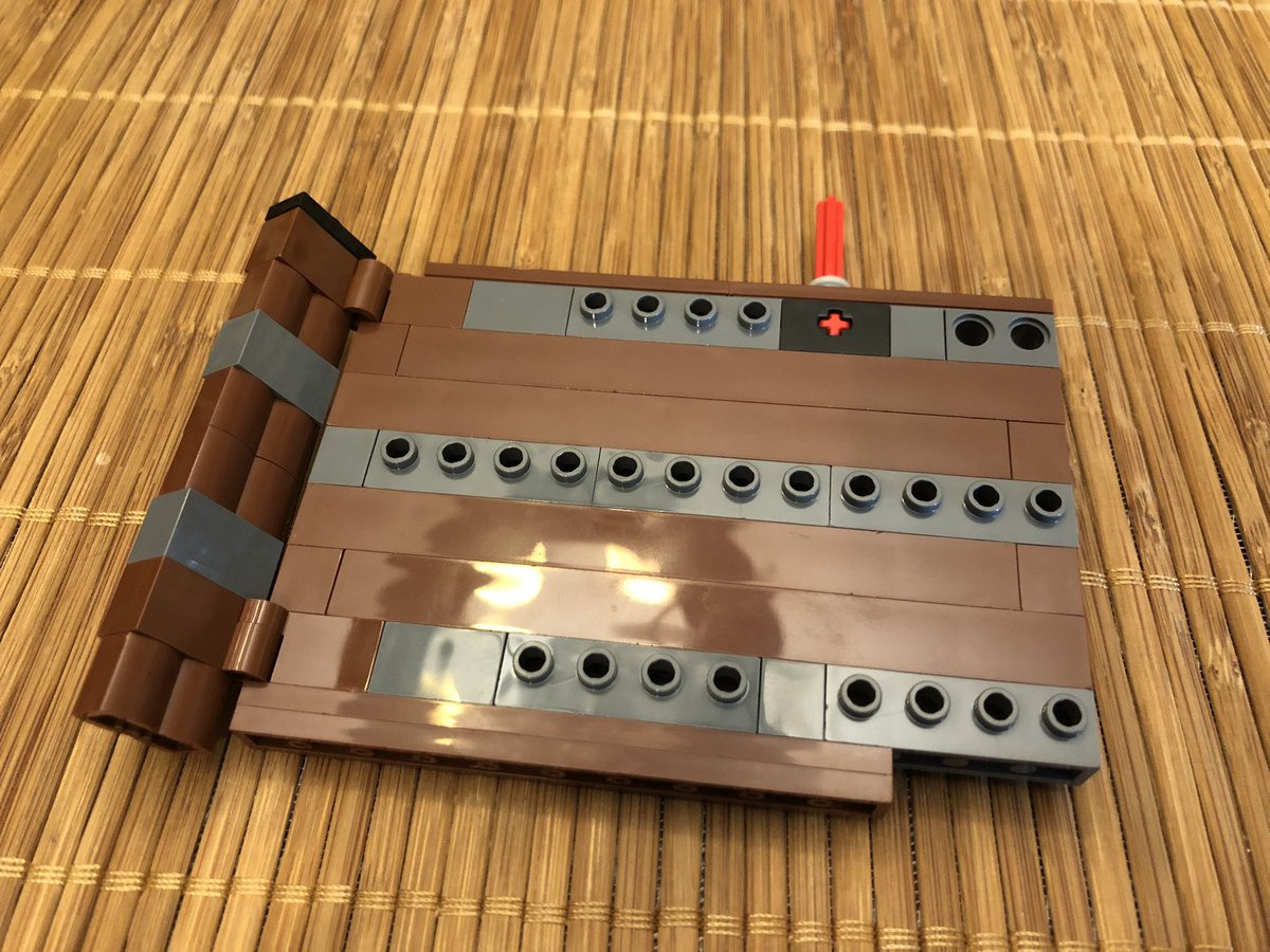 Next, we build a hinged panel. It’s pretty big, and has a single axle hanging off the top.  #LEGO  