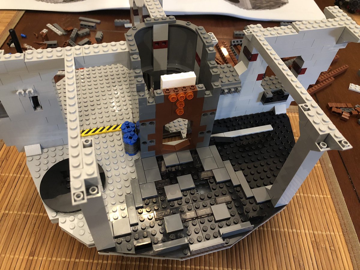 Two columns go opposite the decorative doorway. Secure them to the existing spokes, and put another layer across the top for stability.  #LEGO  