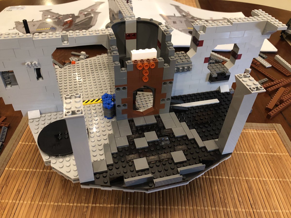 Two columns go opposite the decorative doorway. Secure them to the existing spokes, and put another layer across the top for stability.  #LEGO  