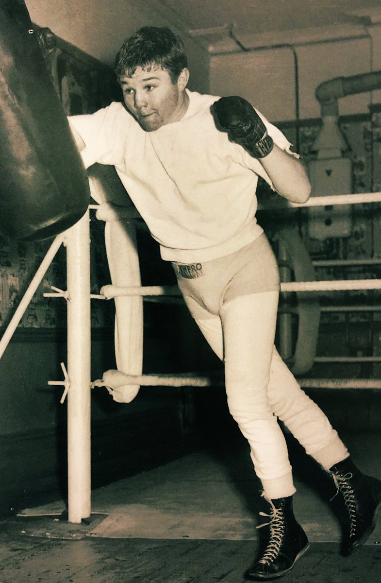 LDNBOXHISTORY's tweet image. Canning Town’s Olympic Champion Terry Spinks goes to work on the bag at The Thomas A’Becket in May 1960.
