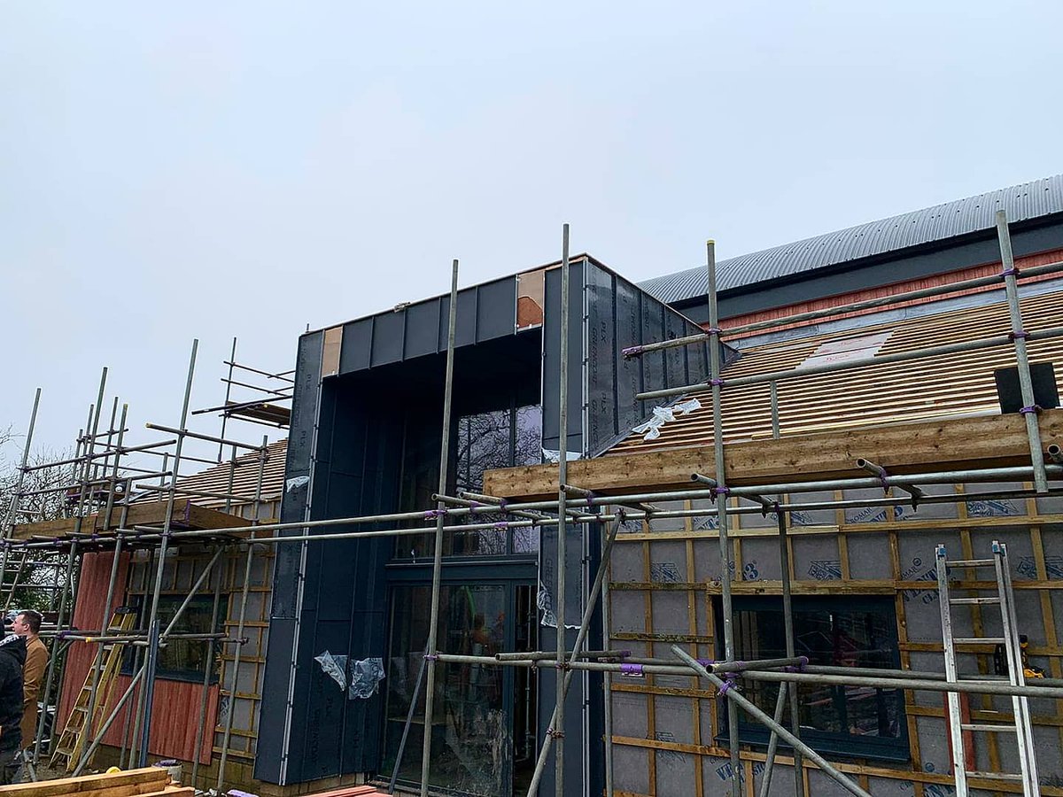 Sharing some progress photos from a project we are working on in Brackley, using Greencoat PLX colour Mountain Grey Pural. Some of the team are installing standing seam cladding to the front entrance of a stunning new home with amazing views! This is going to look great!