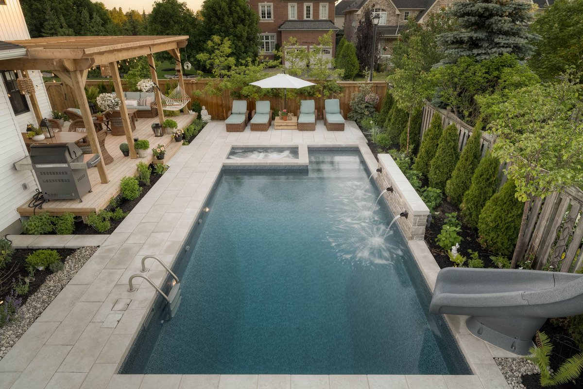 thepoolcraftco's tweet photo. As we head into the weekend, we wanted to showcase one of our favourite projects. 

From the family slide to the landscaping, to the large size of this custom pool, we want to know: what's your favourite part of this backyard design? 

 #outdoorliving #landscapedesign #poolcraft https://t.co/8i1ciUQjE4