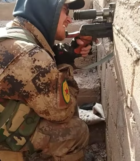 Here's the official press release -  https://www.justice.gov/usao-ndfl/pr/tallahassee-man-arrested-inciting-violence-florida-capitol-buildingSeveral more images- picture of him in his security guard uniform, him being arrested, and him fighting with YPG as a sniper