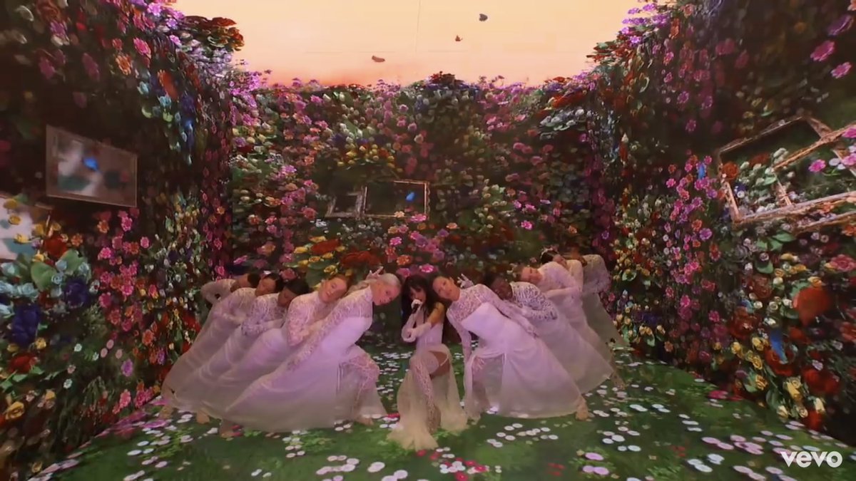 As the video progresses it continues to the second theme of this particular performance which is none other than “the Earth”. The backup dancers in white remain by Camila’s side while we slowly observe the entrance of the rest dancers who are all dressed in pitch black.