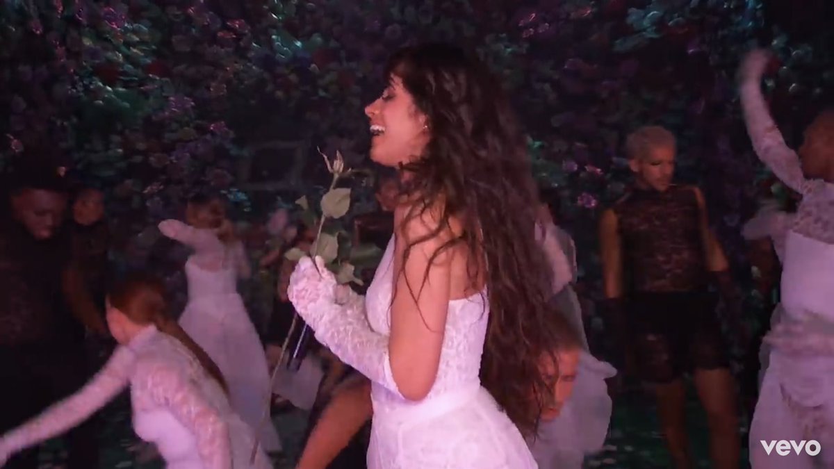 Next we observe a black rose approaching Camila’s body.Camila instead of staying away from that rose and simultaneously the hands trying to get close to her which is yet another metaphor for a sinful and evil situation, she embraces it and connects with it immediately.