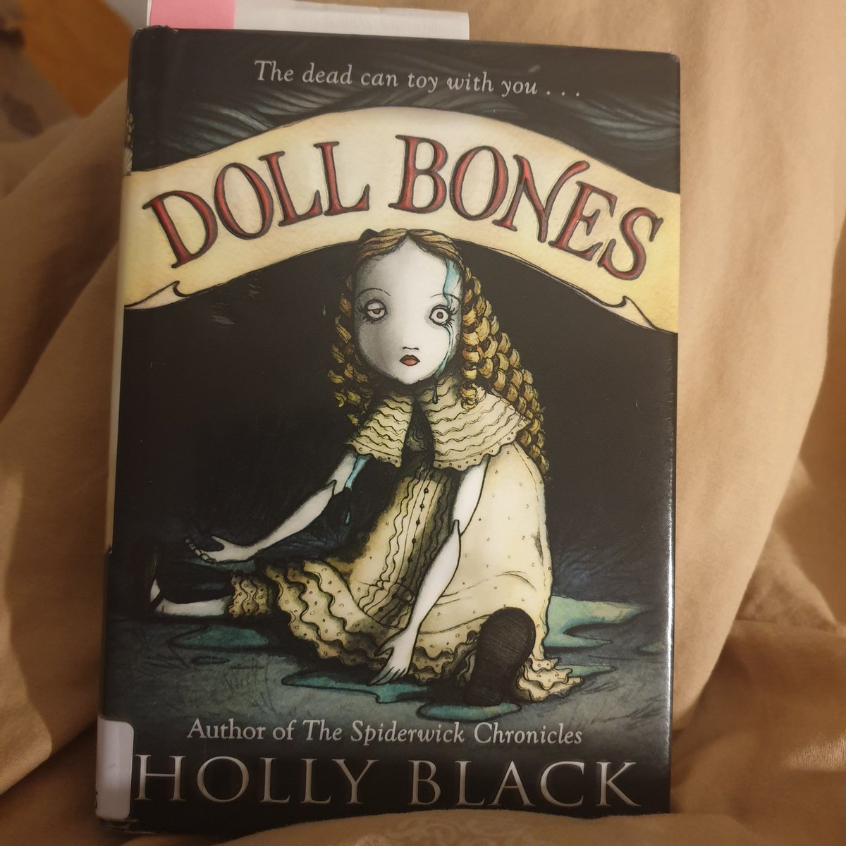 SusanShiney's tweet photo. Just got to the doll part in #dollbones by Holly Black. Things are getting wonderfully weird. 🎊 https://t.co/Ff67qXlvDg