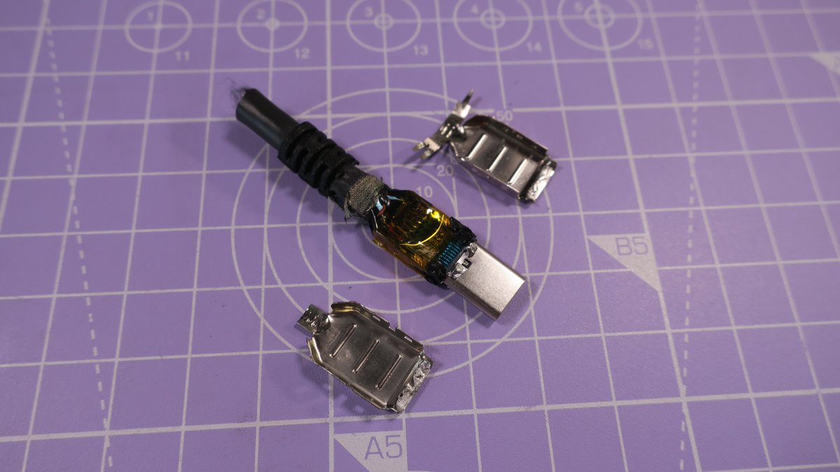 Inside the shield we find a PCB with a bit of kapton tape. You can find hundreds if not thousands of similar Plug + PCB sets on Aliexpress, they seem to be designed for cables like this. We also see the capacitor shown in the datasheet.