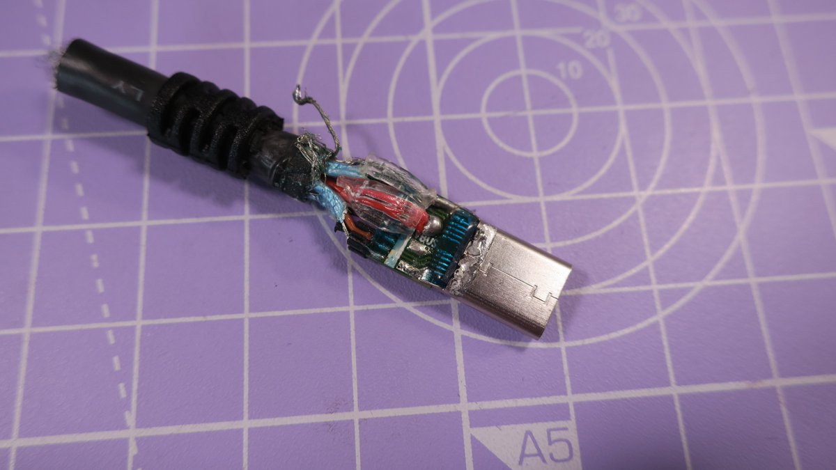 Inside the shield we find a PCB with a bit of kapton tape. You can find hundreds if not thousands of similar Plug + PCB sets on Aliexpress, they seem to be designed for cables like this. We also see the capacitor shown in the datasheet.