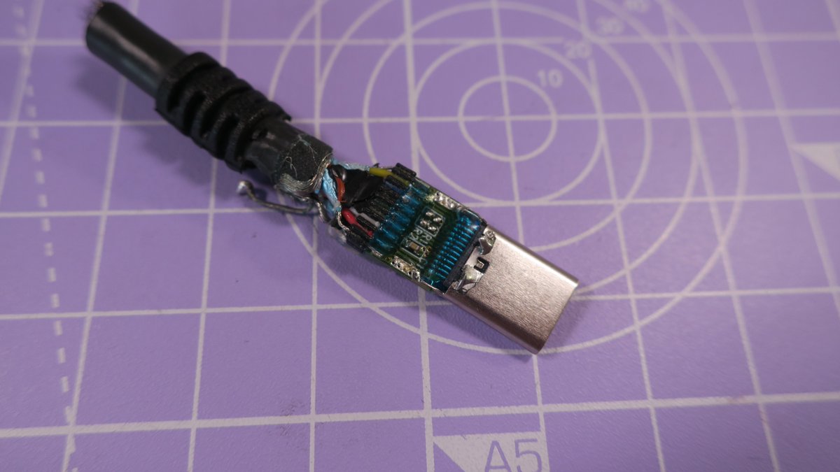 Inside the shield we find a PCB with a bit of kapton tape. You can find hundreds if not thousands of similar Plug + PCB sets on Aliexpress, they seem to be designed for cables like this. We also see the capacitor shown in the datasheet.