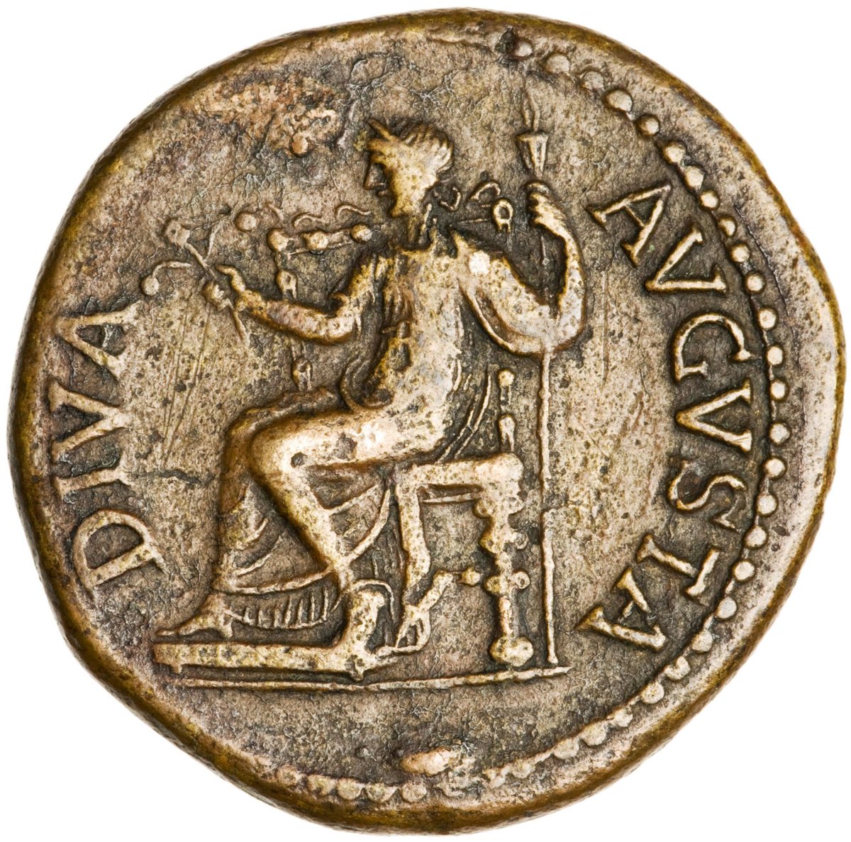 The Reverse shows Livia seated on an ornamental throne, carrying ears of corn in her right hand and wearing a wreath of corn-ears, suggesting the idea of plenty and munificence. The Legend DIVA AVGVSTA - 'The Deified Augusta' - confirms the context of the coin.