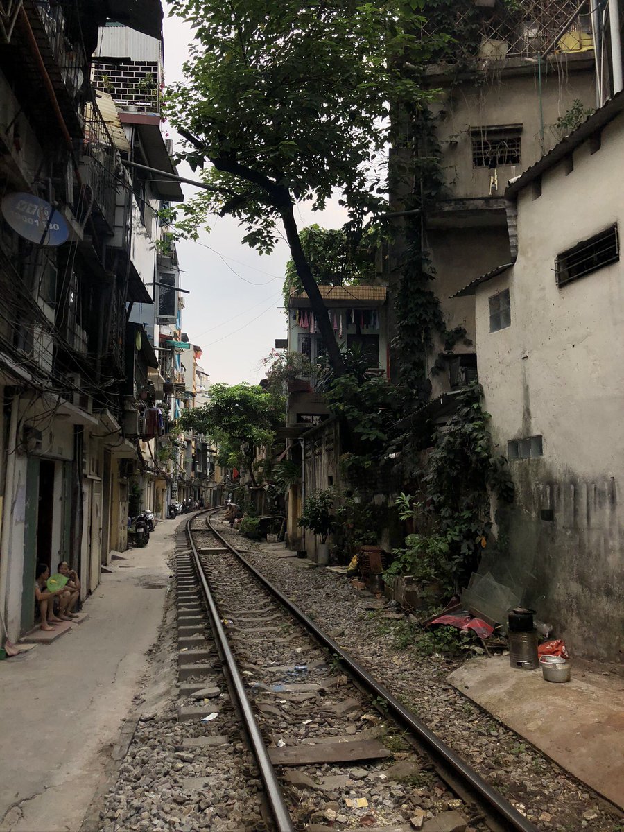 In Hanoi, Vietnam  we went to this spot to see a train pass by. It has become a tourist spot of sorts. Video in next tweet.  #Vietnam  #Hanoi  #Train  #Apple  #shotoniphone (4)