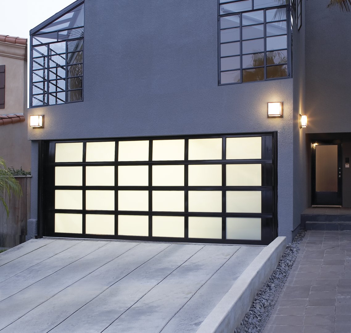 A new #garagedoor can do so much for your home's #curbappeal!😍 

This home got an upgrade with our Modern Aluminum door. The sleek design gives any home a unique, effortless look. Learn more here: bit.ly/320qQzG and contact a distributor today: bit.ly/2TMpToU.