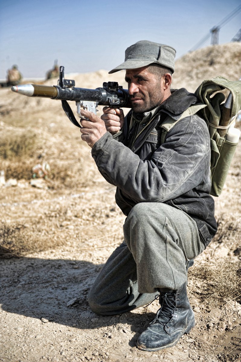 An Afghan Policeman poses with his prized RPG