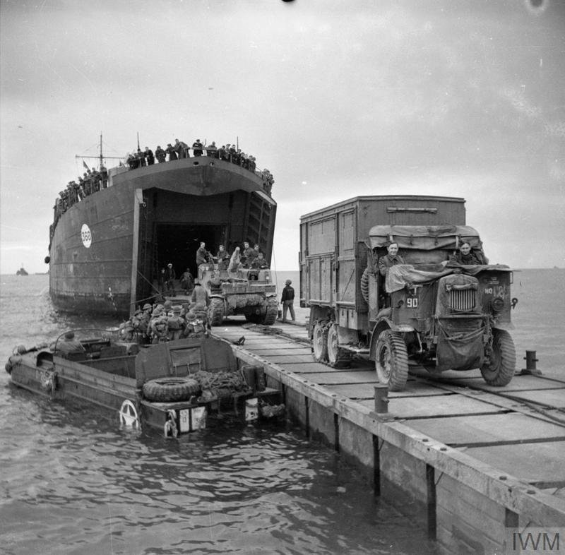 Rhino ferries continued in use in providing additional unloading capacity away from Mulberry B, also seeing use as pontoons. /12