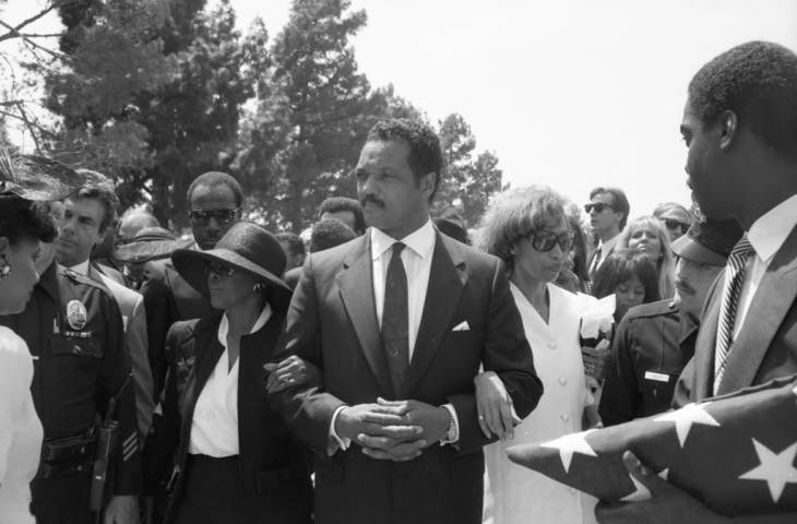 "Jesse Jackson (center) walking alongside with Altovise Davis (right) and Cicely Tyson during Sammy Davis Jr. funeral service." 1990.Source: Cal State