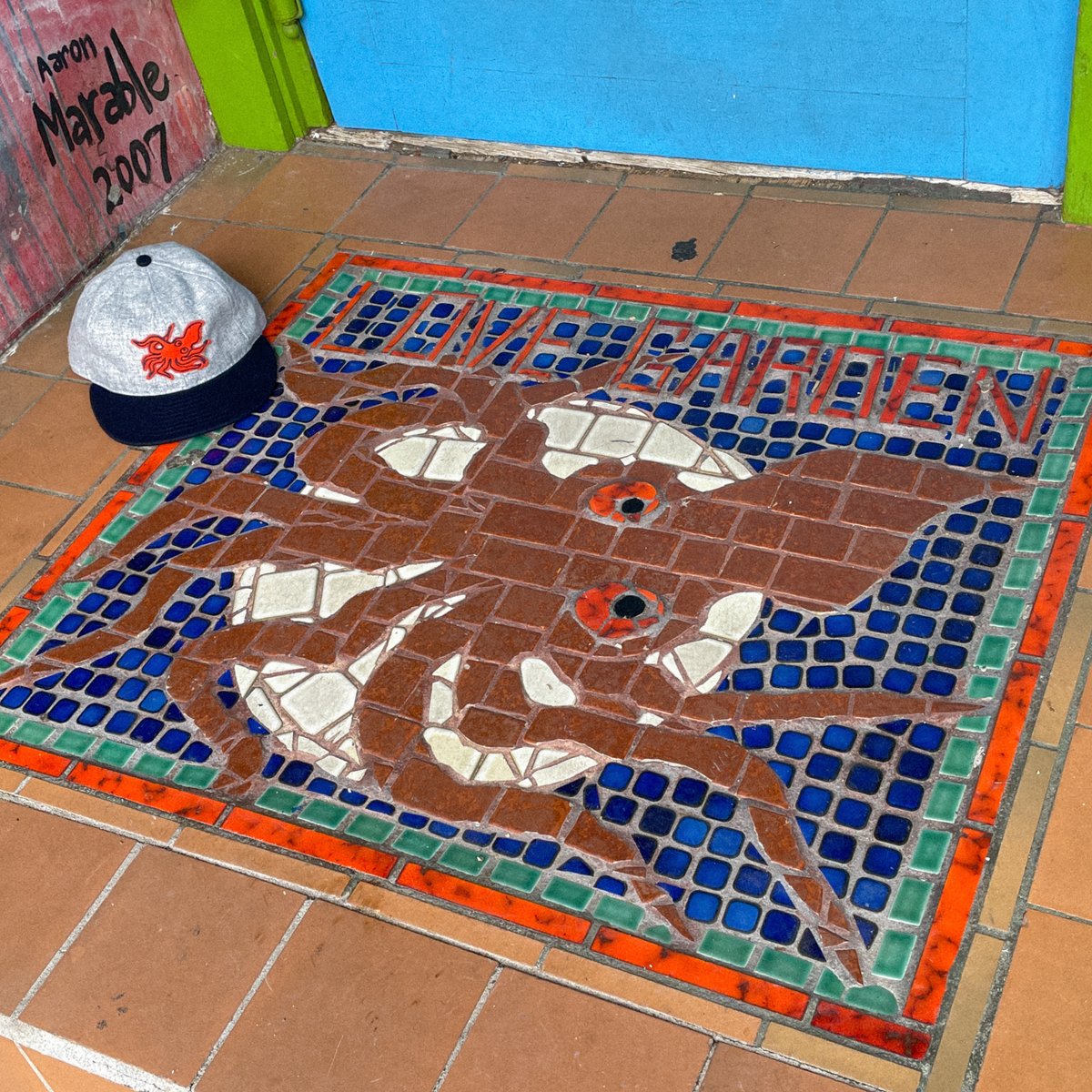 lovegardensound's tweet photo. We're making a run of hats with that are inspired by Gotfred Beardshear's mosaic tile installation at the original Love Garden location entryway.  Real high marks on the design work by @QuietVessel on this one.

https://t.co/lAxTHupEMg https://t.co/qw8mVWJ3gI