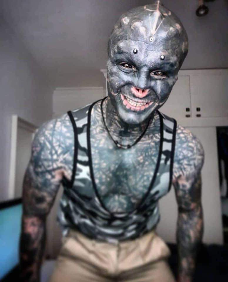 BastardZuma's tweet photo. A MAN has transformed himself into a 'black alien' by having his upper lip REMOVED after cutting off his nose and splitting his tongue.

Anthony Loffredo, 32, has also covered himself in tattoos and piercings to make himself look like a real-life alien. https://t.co/cLY4S6XkoL