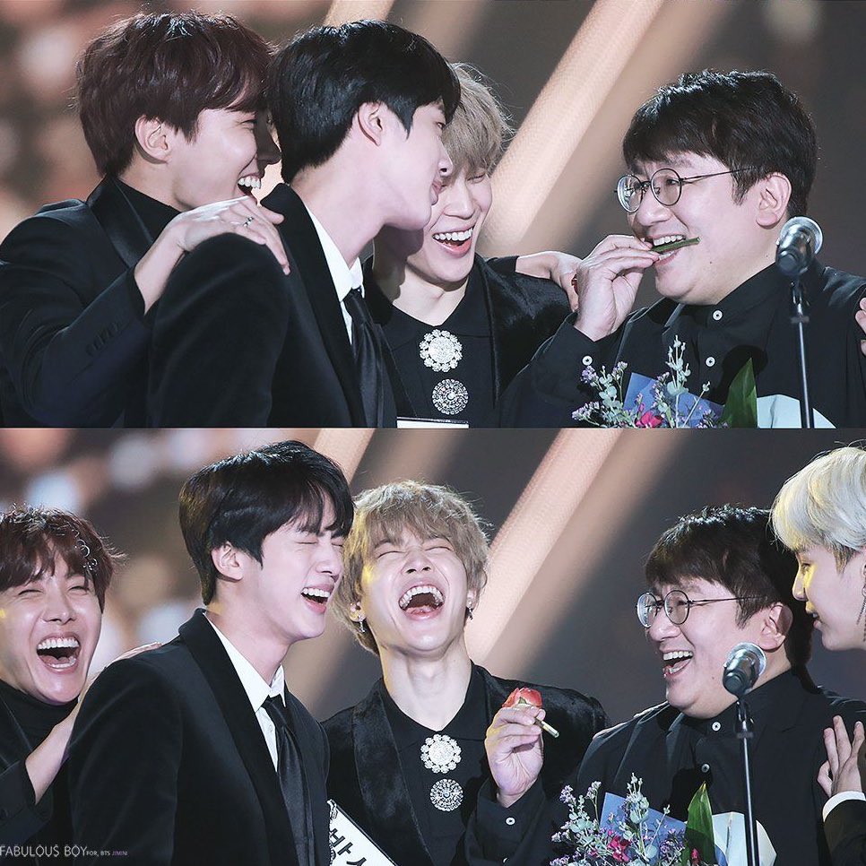 When bang pd won producer of the year and bangtan went on stage with him. Seokjin bit the rose and bang pd also put it in his mouth making tannies laugh + this seokjin tweet too