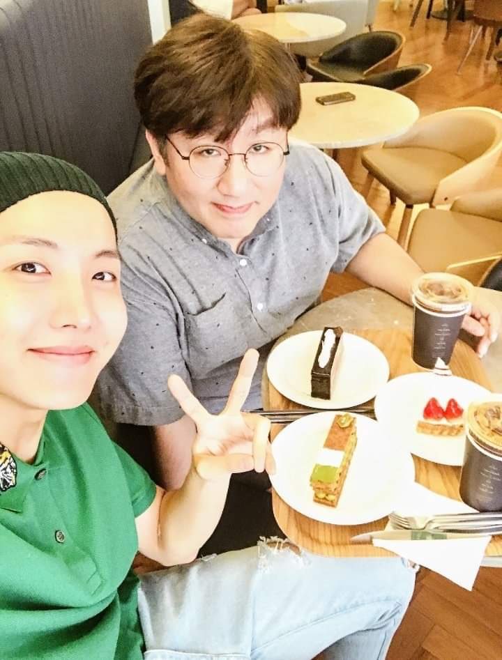 Hobi and bang pd eating together and this hobi tweet showing a video of bang pd taking video of the food