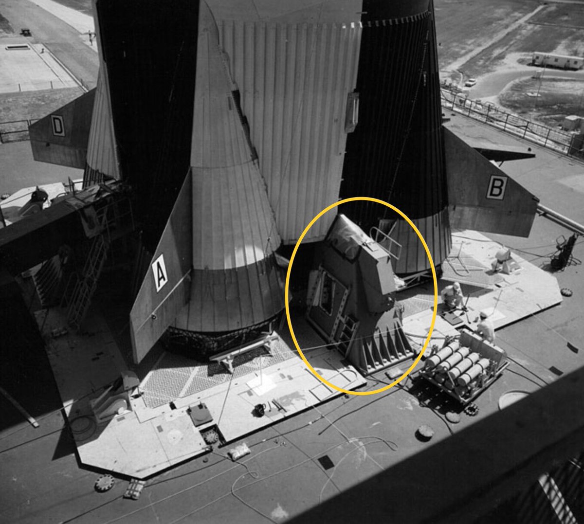 Despite looking like they might support the Saturn V they served a different function entirely.4 hold down arms (pic 1 & 2) supported the entire weight of the booster and kept it steady.The viscous damping system also connected to the base of the escape tower (3) for stability.