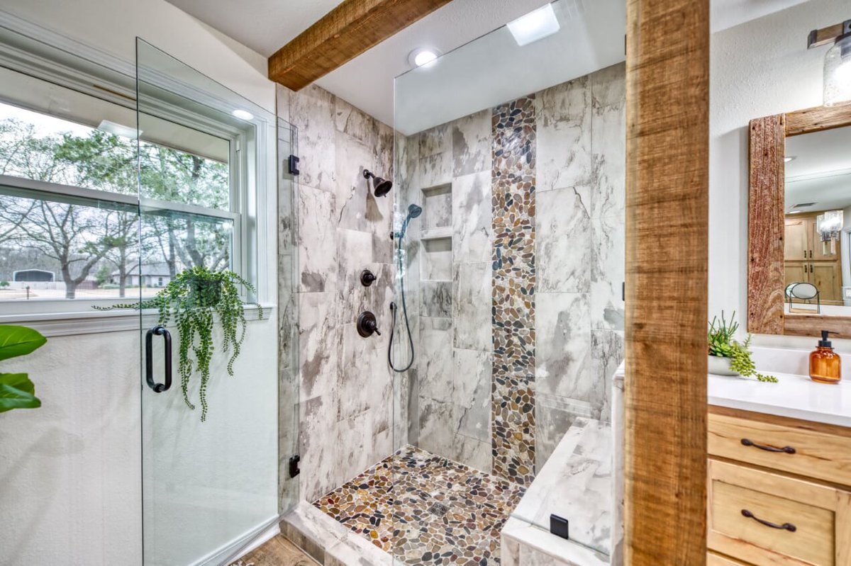 Our client texted last night and said taking a shower felt like she was showering under a waterfall in the woods. #dreamy #rusticbathroom #bathroomremodel #bossiercity #foreverhomemakeover