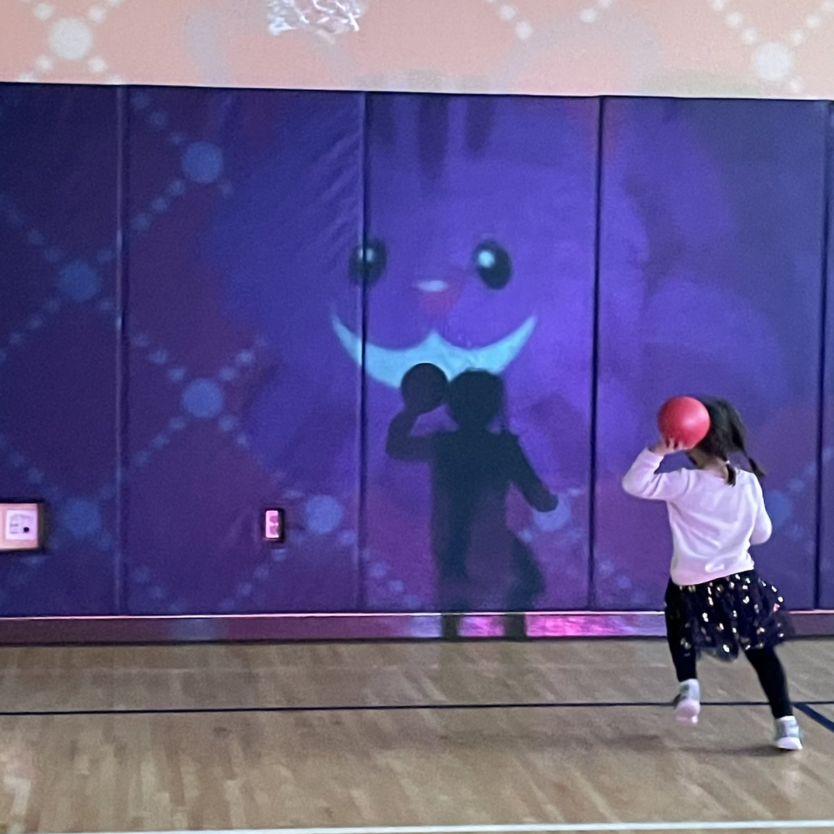 Students in Kindergarten practiced their hand-eye coordination. They were aiming for the Cheshire Cat’s smile as it moved across the gym wall. <a href="/AshlynDerosier/">Ashlyn Derosier</a> <a href="/LSSNorthboro/">LSS Northborough</a>