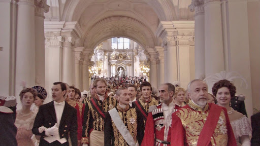 Russian Ark (2002) follows a ghost and his long-dead European aristocrat companion through the Winter Palace in St. Petersburg, bouncing through several hundred years of shared history and culture. Innovative and beautiful; shot in a single take.