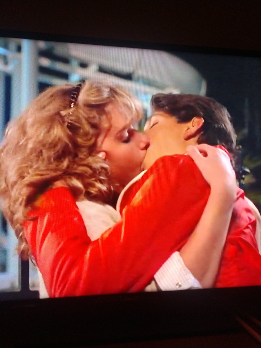 Okay, let me start by saying I'm glad Daniel got to kiss the girl. But this.....is the worst kiss of all time. Macchio is eating her face.