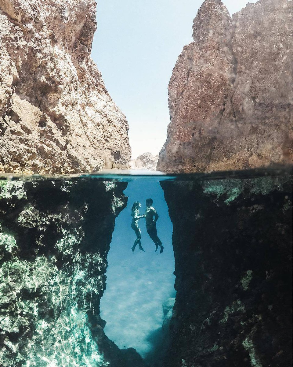 We're just two lost souls 
swimming in a fish bowl..