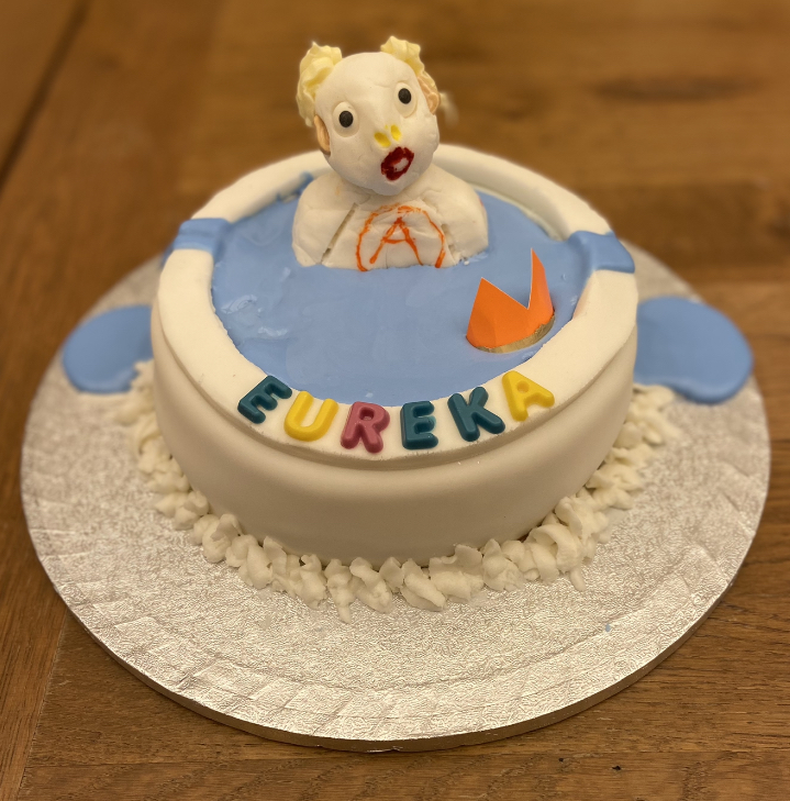 PhysicsCakes's tweet photo. And the winner of the #GreatPhysicsBakeOff is… 

Maddie, for her depiction of Archimedes in the bath!  Congratulations Maddie!! https://t.co/03DKIxsnGv