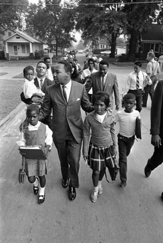 MLK escorts Black children to a formerly all-white school in Grenada, Mississippi on September 20 in 1966.  #OTD  #MLK    #MLKDay    #MLKDay2021  