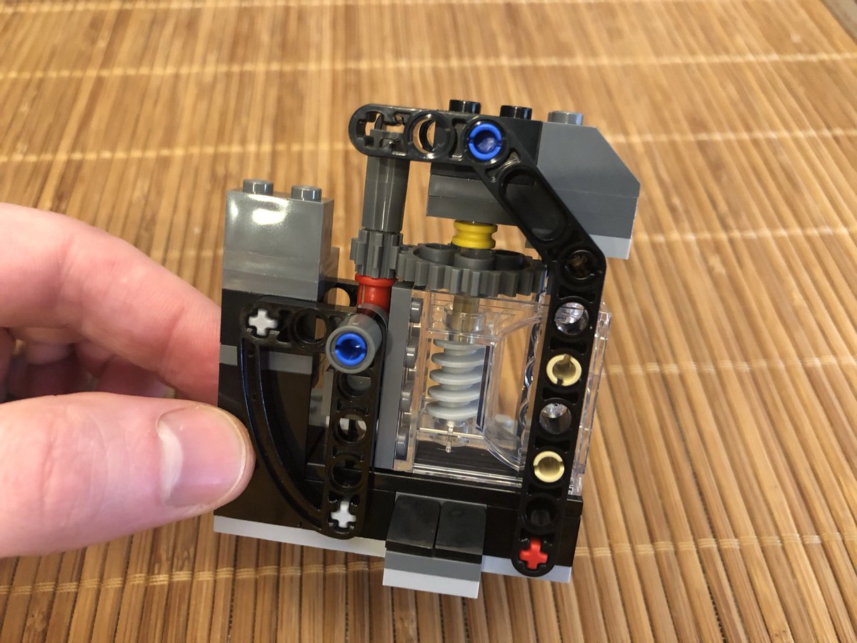 ...attach it to the base. Here’s where I missed something - a large gear is secured with the red axle in the second photo. Taking it apart 20 steps later was not easy. This angle bracket rotates freely.  #LEGO  