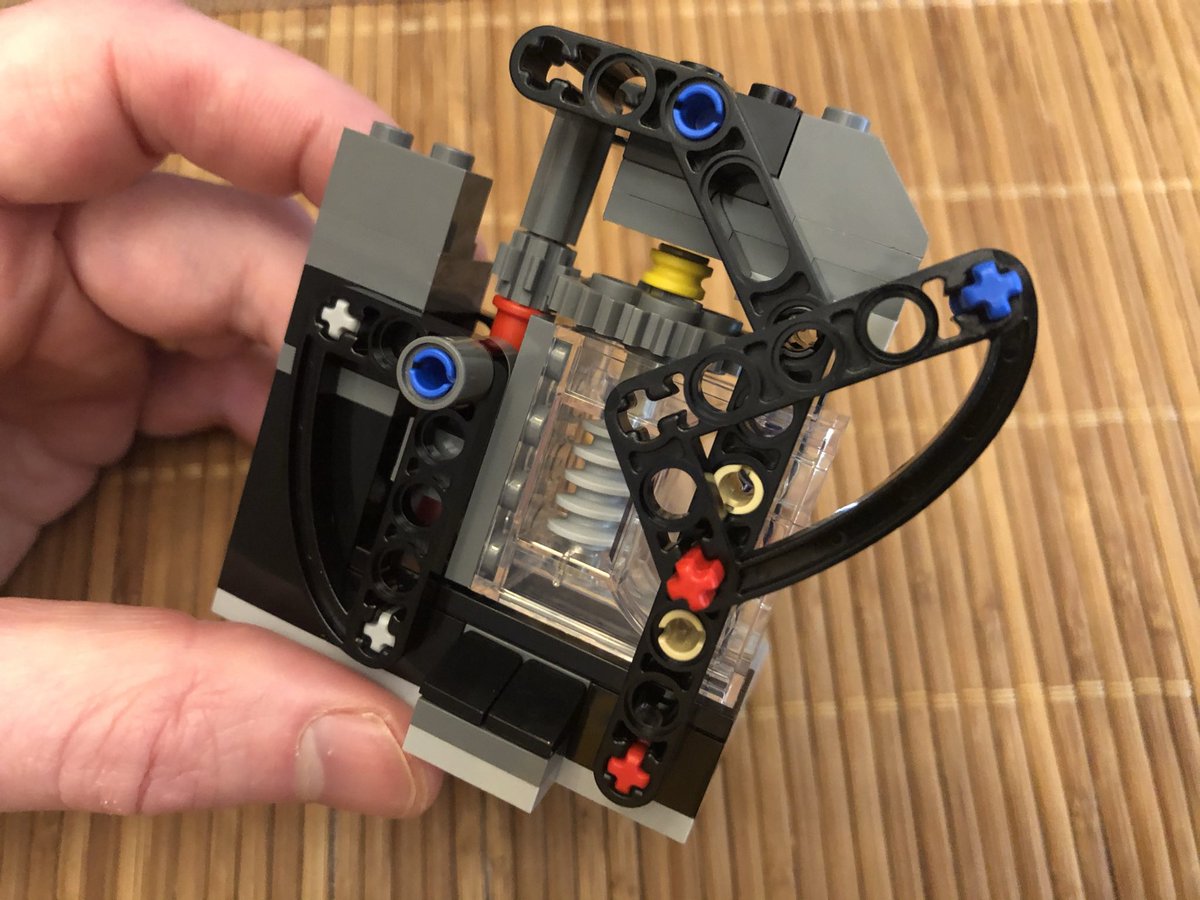 ...attach it to the base. Here’s where I missed something - a large gear is secured with the red axle in the second photo. Taking it apart 20 steps later was not easy. This angle bracket rotates freely.  #LEGO  