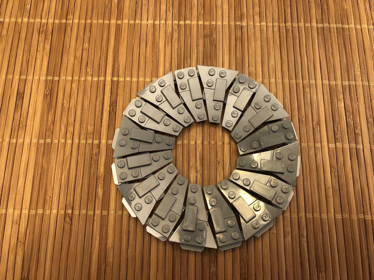 This part kind of sucks. This chain of 16 assemblies takes a while and it’s small pieces with sharp corners. Then these plates go on the black tilting plate. Make sure they point downward, or you’ll have to flip em around like me, then link them in a circle.  #LEGO  